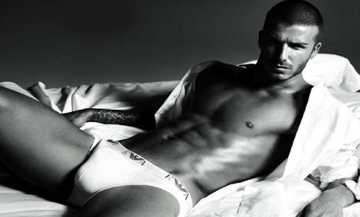 david beckham flaunts toned abs in new ad see pics