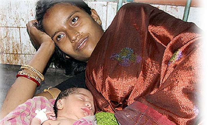 newborn baby survives fall through train toilet on rail