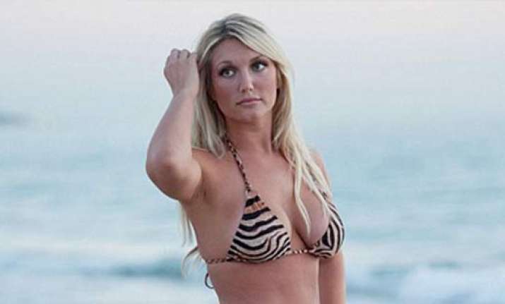 brooke hogan poses in tiger print bikini