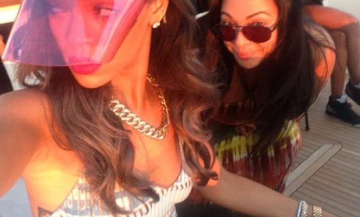 rihanna flaunts cleavage and soaks up the norway sun