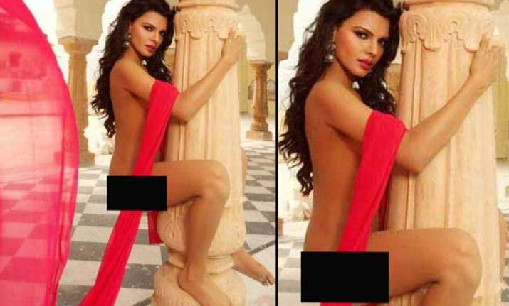 sherlyn chopra poses nude with a pillar view pics