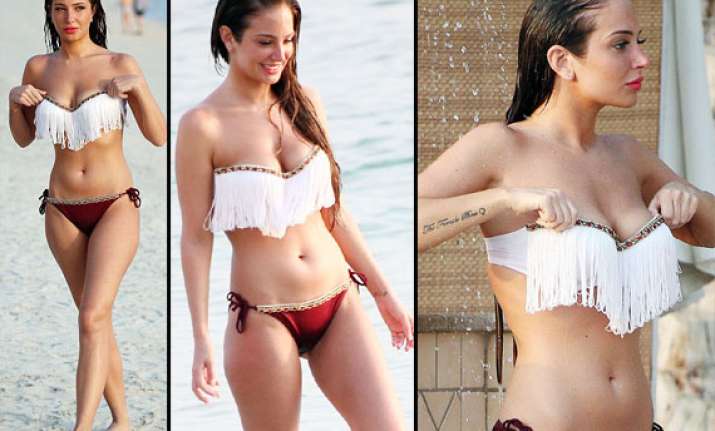 tulisa contostavlos seduces in a skimpy bikini view pics