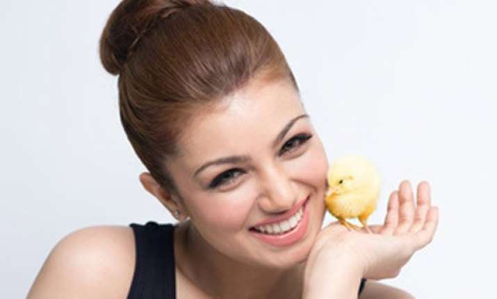 ayesha takia poses with a chick for peta