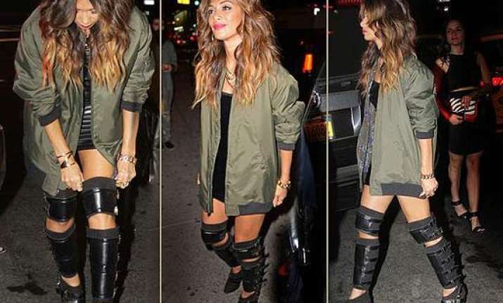 nicole scherzinger shows off wacky boots