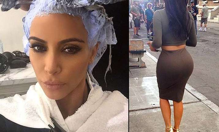 kim kardashian sheds her sexy blonde image goes dark again