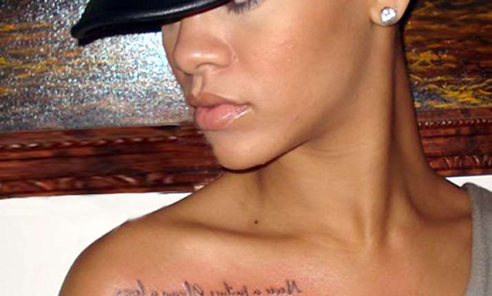just got inked rihanna flaunts her new tattoo view pics