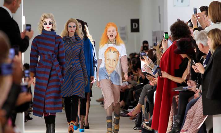 westwood champions assange on london catwalk
