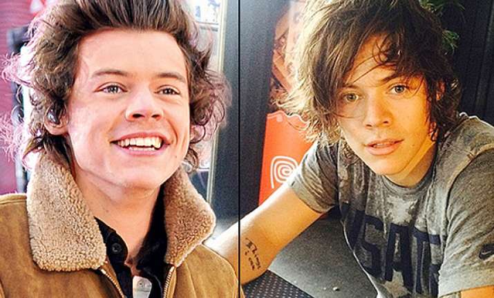 harry styles ditches quiff for matted down hairdo