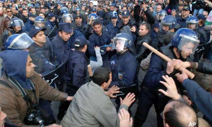 thousands demand reforms in algeria 400 arrested