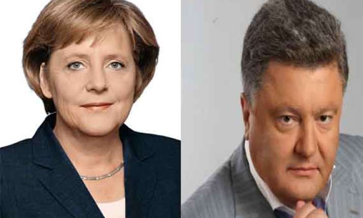 angela merkel congratulates poroshenko vows more support