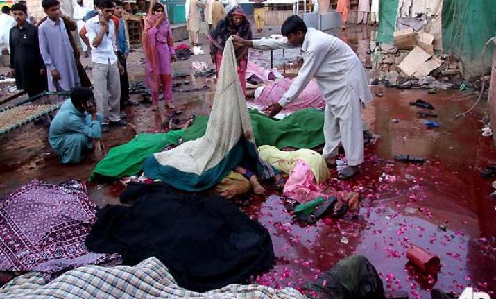 taliban twin bombers kill 42 at shrine 100 injured