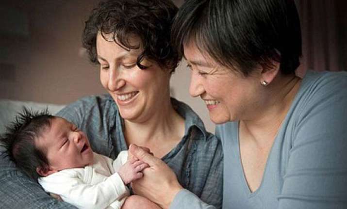 australia s lesbian finance minister announces birth of