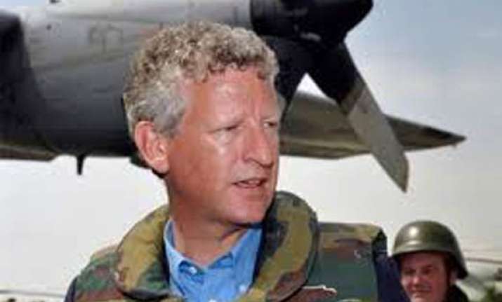belgium to cut its troops in afghanistan by half