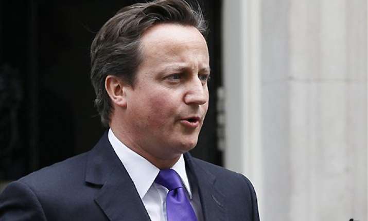 cameron defends actions but offers regret in hacking scandal