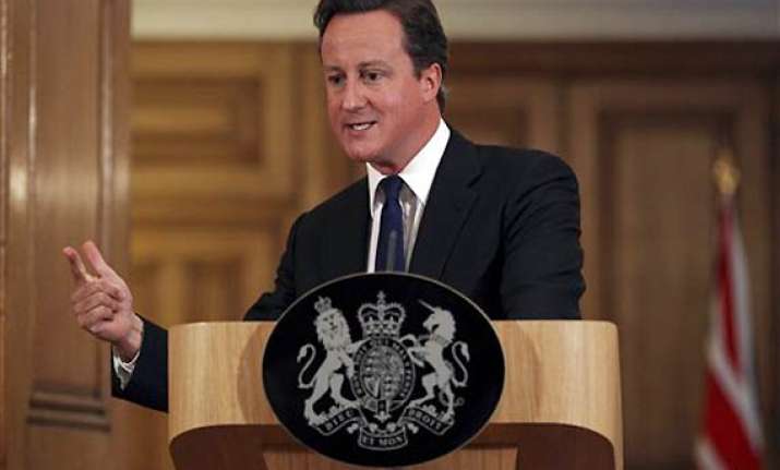 cameron promises media regulation overhaul ex aide arrested