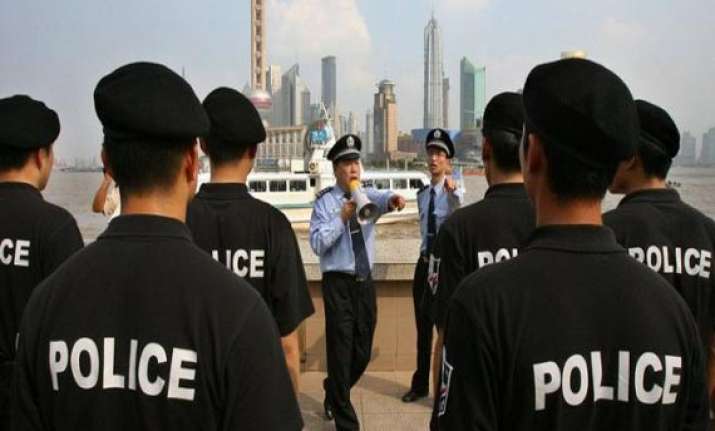 china arrests british american investigators