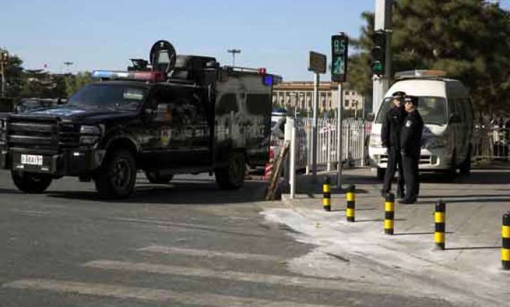 chinese police seek 8 following tiananmen attack