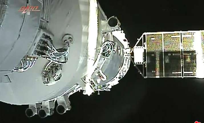 chinese craft returns from space docking mission