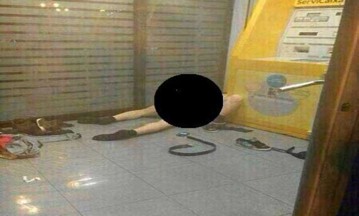 couple in spain caught having sex next to atm