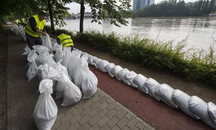 crest of swollen danube surges towards budapest germany