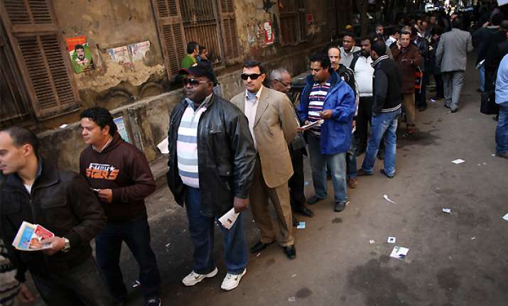 egyptians wait in long lines to elect a parliament