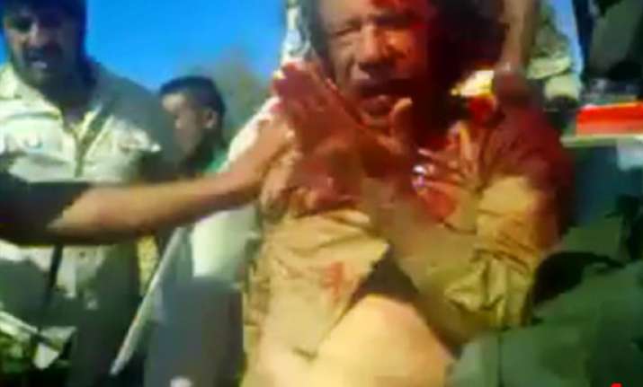 gaddafi begged for life offered gold money to captors