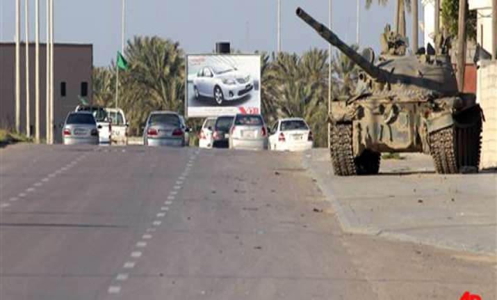 gaddafi forces push towards ajdabiya 5 killed in misurata