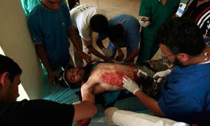 gaddafi forces attack misrata as nato vows no let up