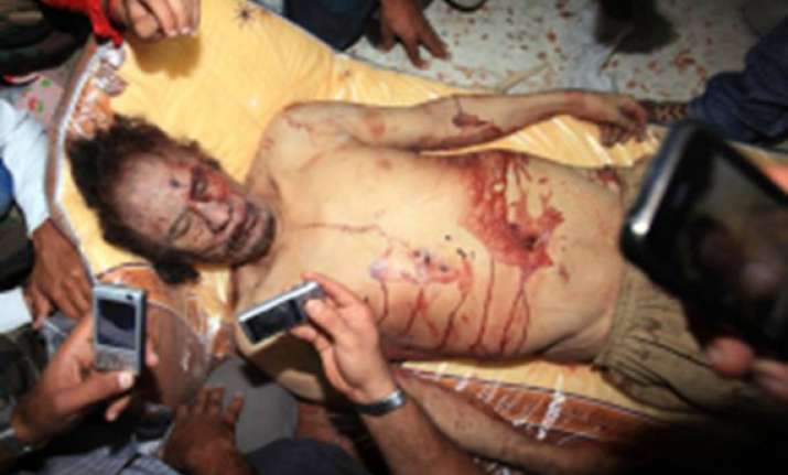 gadhafi put on display in shopping center freezer