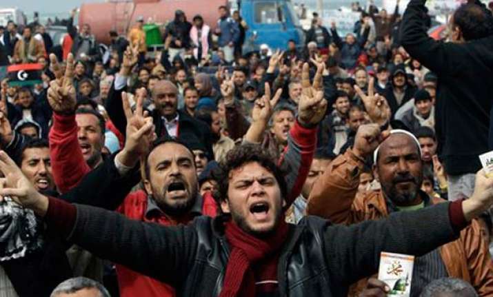 gaddafi regime arming civilians for civil war