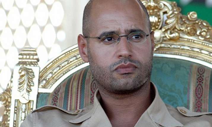 gaddafi son a sex addict ex wife