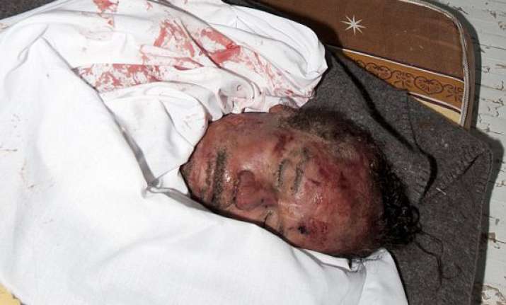 gaddafi son mutassim buried in unmarked desert graves son