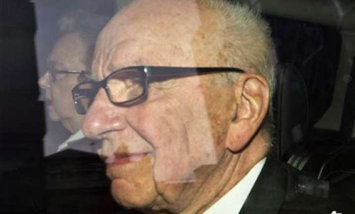 house of lords rips into murdochs saying sorry