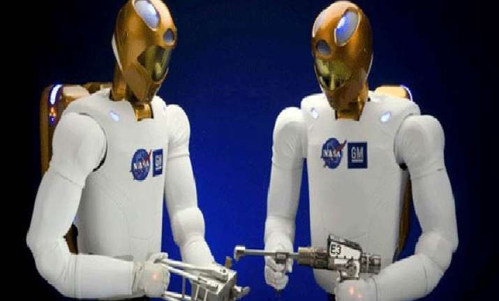 human and humanoid robot shake hands in space