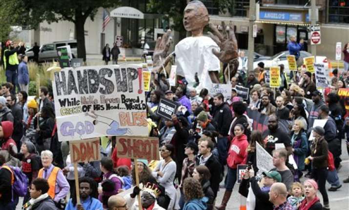 thousands protest police shootings in st. louis