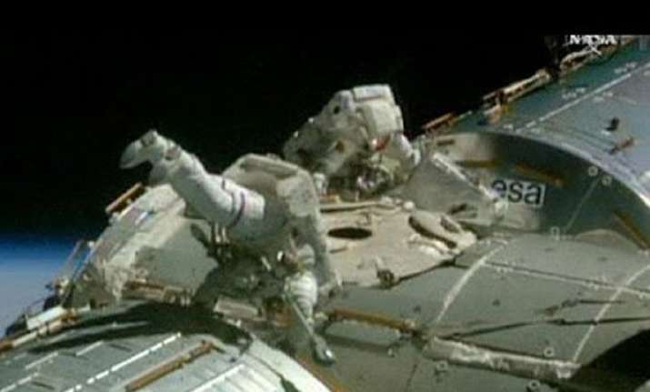 nasa astronauts finish spacewalk trilogy for space taxis