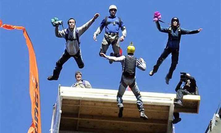 wheelchair parachutist rolling off 876 foot bridge