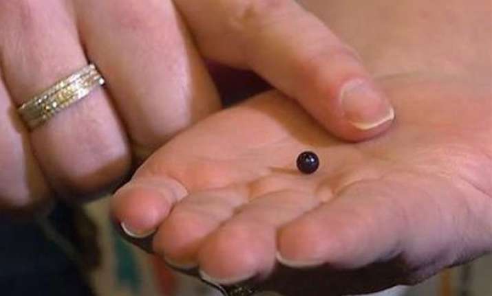 woman bites rare pearl while dining at italian restaurant