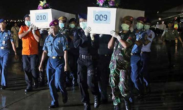 some airasia victims found belted in seats