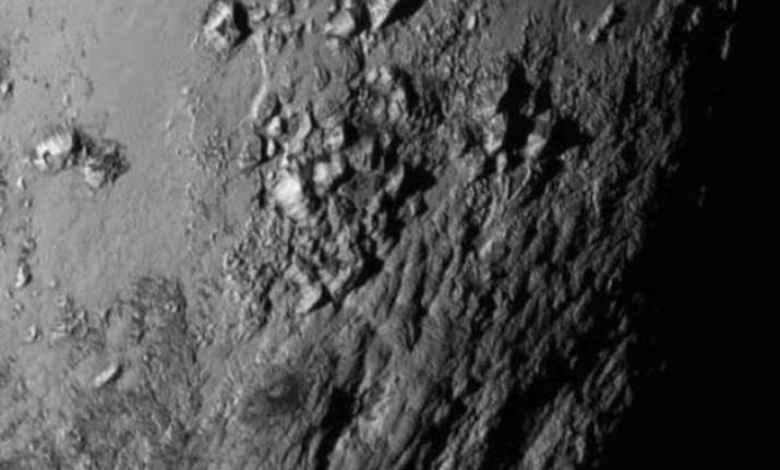 pluto has 11 000 feet high young ice mountains nasa