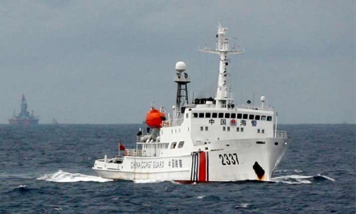 china defends its south china sea activities as restrained