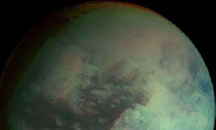 saturn s moon titan glowing at dusk and dawn