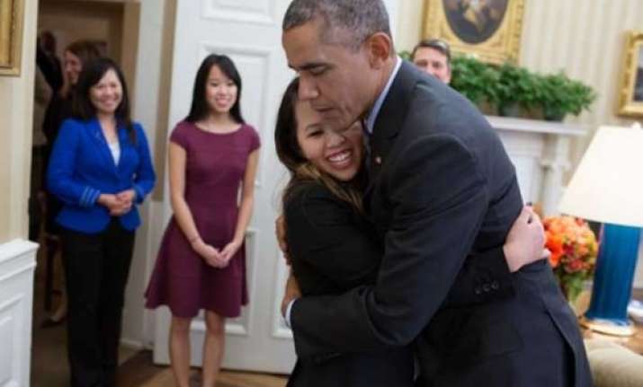 barack obama hugs nurse who survived ebola