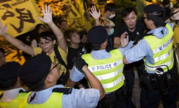 hong kong police arrest 19 at protest site