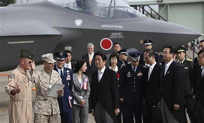 japan cabinet okays record military budget with eye on china