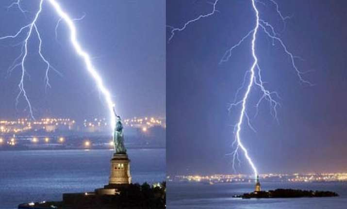 amazing pic of huge lightning bolt striking statue of