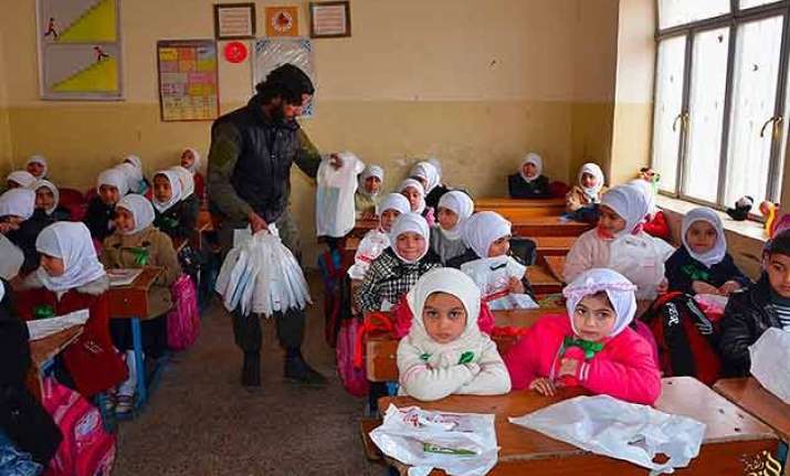 in an is training camp children told behead the doll