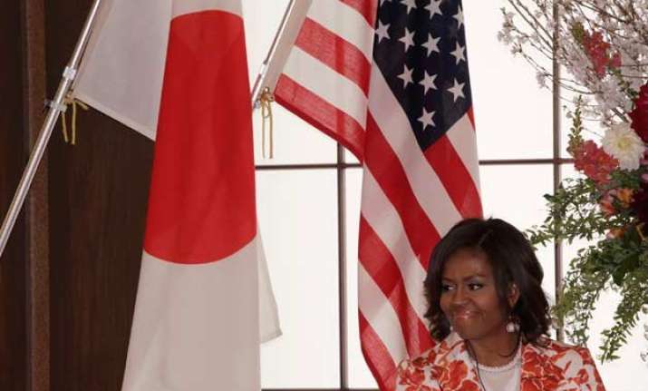 michelle obama visits japan to showcase girls education aid