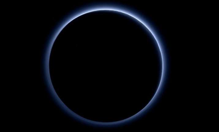 blue sky and red ice at pluto nasa spacecraft discovers