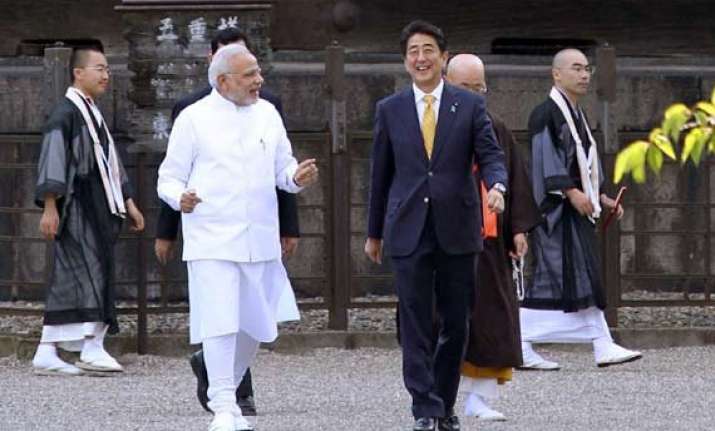 pm modi arrives in tokyo to hold summit talks with abe
